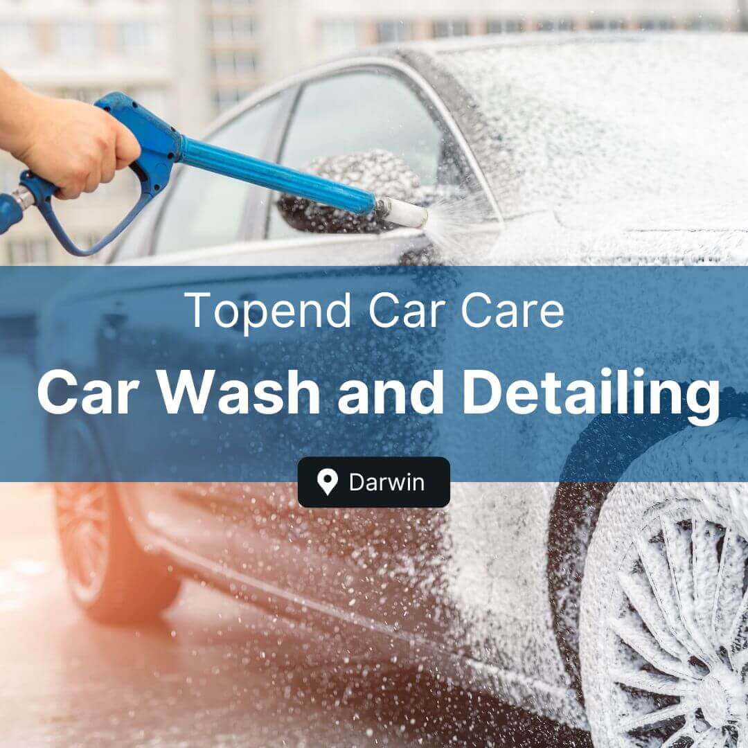 Car being washed with foam and a pressure washer